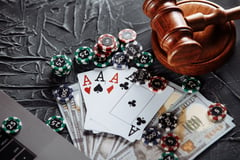 Judge wooden gavel poker chips money playing cards concept law regulation gambling qbflv gs